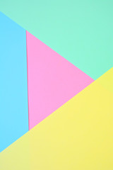Beautiful pastel abstract trend background with yellow, mint, blue and pink (dusty rose). Light texture, blank. Flat lay, top view, copy space.
