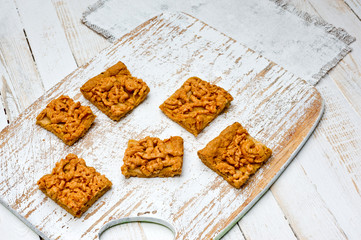 .Homemade shortbread cookies lying on a white painted wooden surface. Baking and cooking.