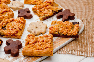 Homemade shortbread cookies lying on a white painted wooden surface. Baking and cooking.