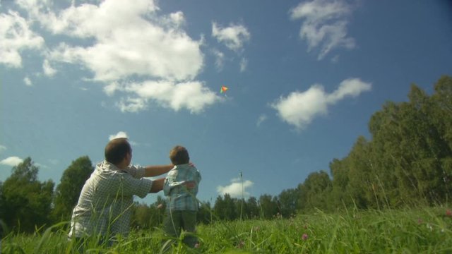 Father, child and the kite
