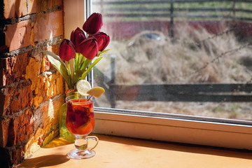 cocktail in a glass with natural light on the window