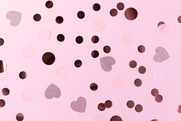 Multicolored confetti on pink background. Festive banner for text. Ready layout for designers.