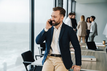 Attractive young confident businessman in formal wear