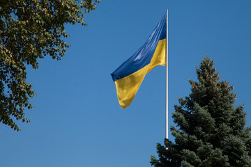 Ukraine flag on a background of blue sky