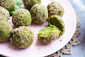 Pkhali - green vegetables peas, chickpeas beans balls. Cold snack with herbs, seeds and nuts. Vegan food