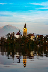the church on bled lake at sunset