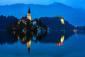 bled lake at sunset and lights reflected on the water