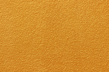 Gold paint on cement wall texture or backgrond