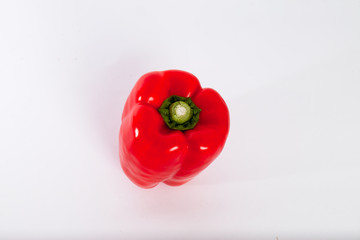perfect red bell pepper on a white backdrop.