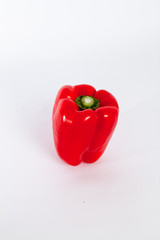 perfect red bell pepper on a white backdrop.