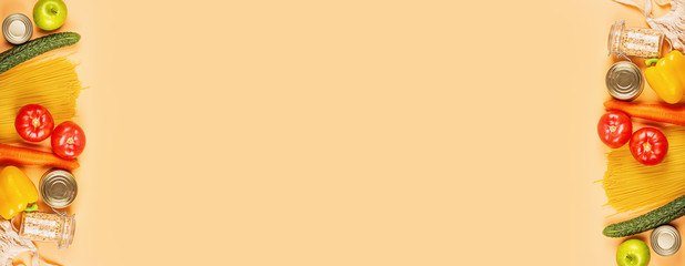 Donation food on orange background with copy space. Flat lay. top view, Mockup. Food donations or food delivery service concept. Online shopping during coronavirus covid-19 lockdown