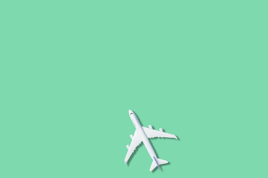 Model plane,airplane on green color background. 3d rendering