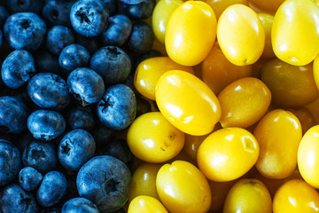 Mix of yellow and blue berries. Summer mick fruit. Berry layout