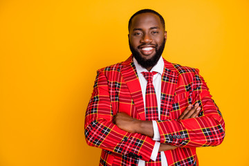 Obraz premium Photo of attractive dark skin guy arms crossed toothy beaming smiling self-confident person wear plaid red costume blazer shirt tie isolated bright yellow color background