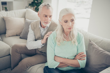 Close-up photo of careful happy smiling positive kind sincere old granddad trying to come to common ground with his beloved beautiful old lady