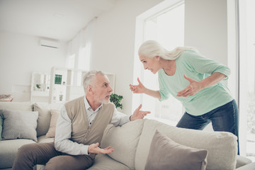 Obraz premium Photo of sad upset shouting old lady do not want to understand her husband