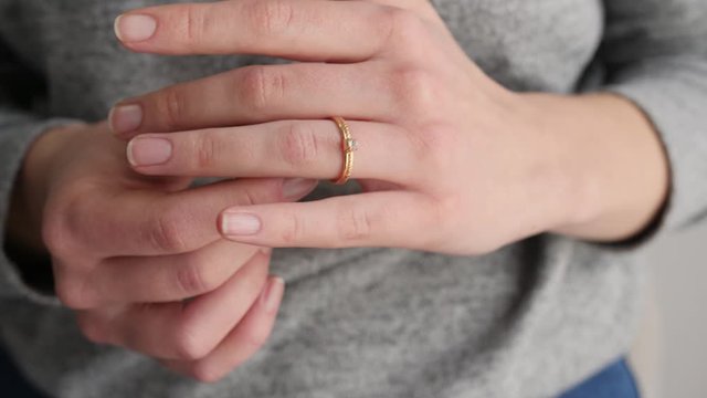 Young woman with beautiful ring on her finger, closeup