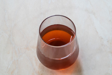 Glass of Cognac on Marble Surface. Ready to Drink.