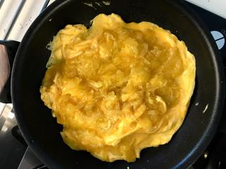 Omelette with Grated Potatoes in Pan. Ready for Breakfast.