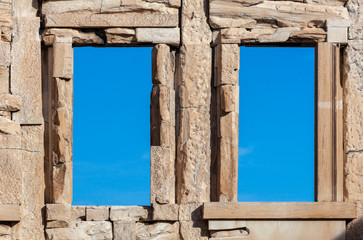 Two windows in the ruins of an ancient building.