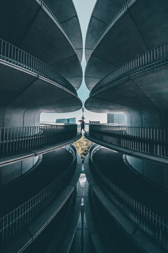 Woman Standing On A Symmetrical Structure