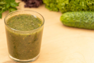 Green healthy smoothie. Salad in a glass. Watch your diet. Vegetarian preferences. Yummy.