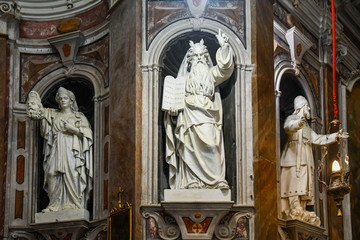 Fototapeta premium Interior of the Lady of the Coast (Madonna della Costa) Sanctuary with the wooden statues of St John the Baptist, St John the Evangelist and St Zacharias, Sanremo, Imperia, Liguria, Italy