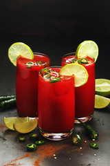 Jalapeno tomato margarita cocktail with lime