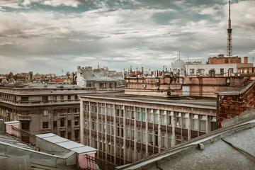 Fototapeta premium Amazing sunset on the roofs of the old district of St. Petersburg
