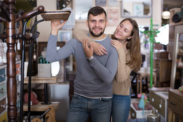 Couple in antique furnishings store