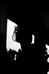 silhouette of a woman in a window