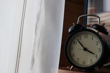 Obraz na płótnie Canvas Large old vintage alarm clock with bells at home