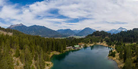 Fototapeta na wymiar Aerial panorama view over lake Frauensee at Tirol alps mountains in spring
