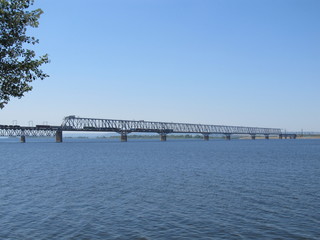 Railway bridge over the river. Sunny spring day.