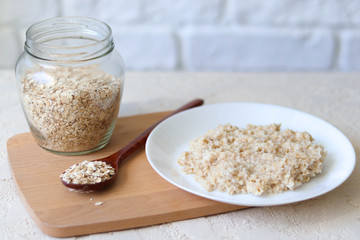 Oatmeal and glass jar with oatmeal, vegan breakfast