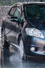 Self-service car in a car bubble wash.