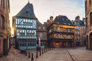 Beautiful street of the medieval French city of Dinan with ancient half-timbered houses. Popular tourist city of France. Dinan is a walled Breton town and  tourist attraction in Brittany, France.