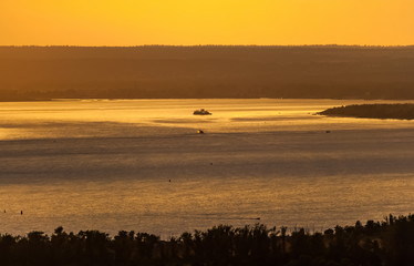 Landscape with sunset on the river in summer