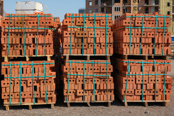 Red brick pallets at a construction site