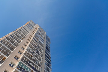 Obraz premium New tall house on a background of blue sky