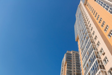 Fototapeta premium New tall house on a background of blue sky