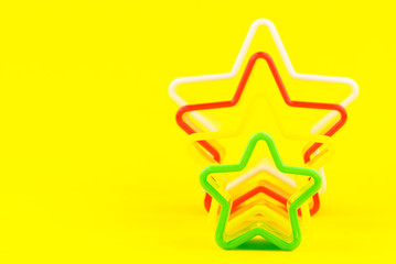 Star shapes isolated on yellow background.