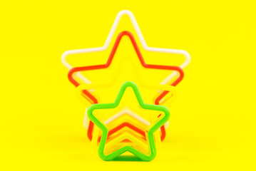Star shapes isolated on yellow background.