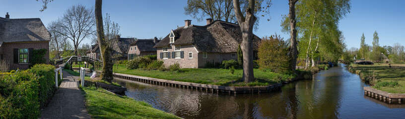Giethoorn Overijssel Netherlands. During Corona lock-down. Empty streets, paths, bridges and canals. Old farmhouse panorama