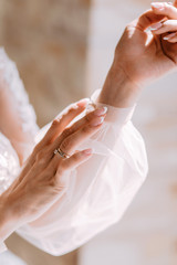 Hands of the bride. A gentle image of a girl. Wedding fees of the bride