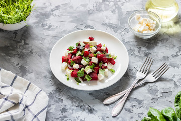 Baked beets with feta cheese and shoots of young peas