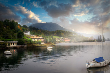 Fototapeta na wymiar Panoramic view of the lake with boats