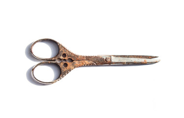 Old scissors on a white background