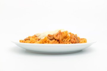 Fusilli pasta on white background