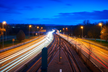 Fototapeta na wymiar Lighttrails auf einer Autobahn zur blauen Stunde. Der Weg in die Zukunft.